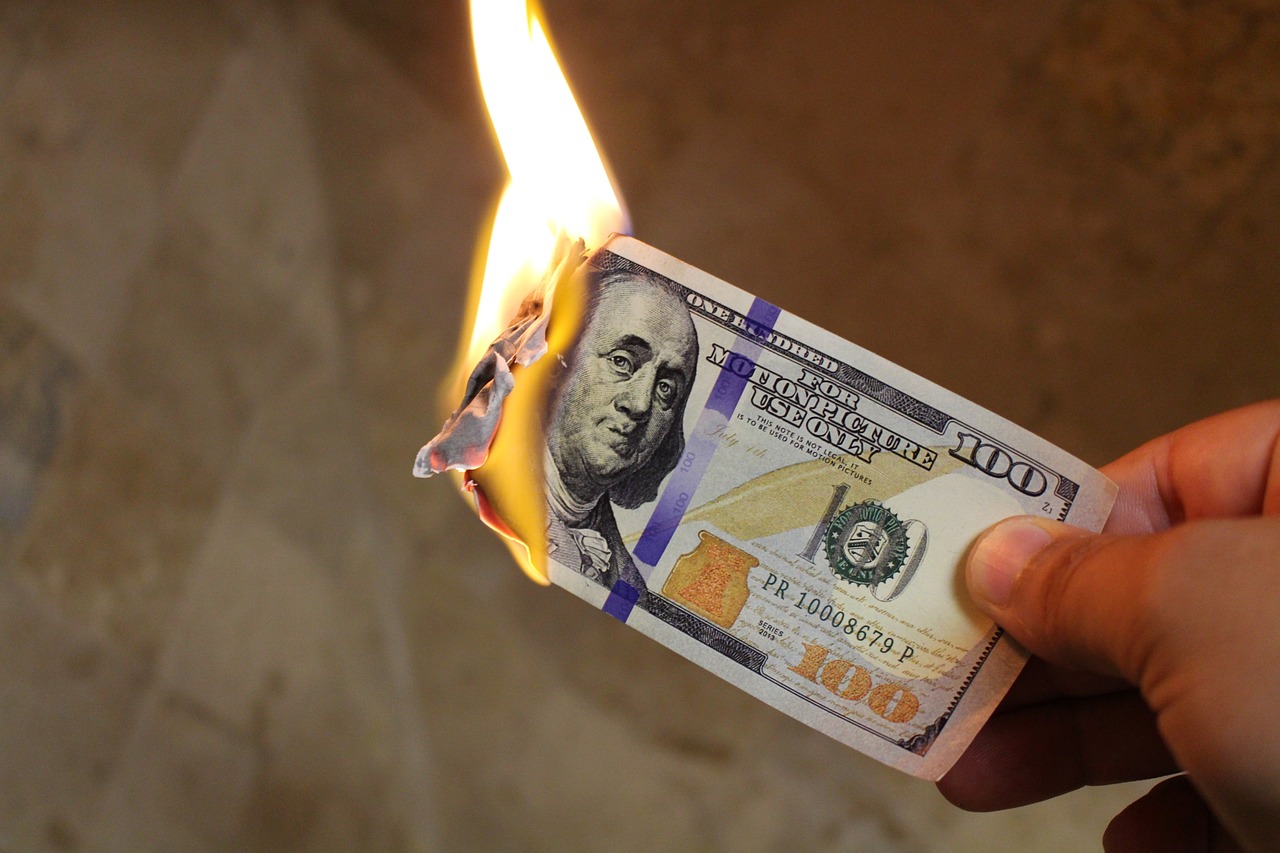 burning money, dollars